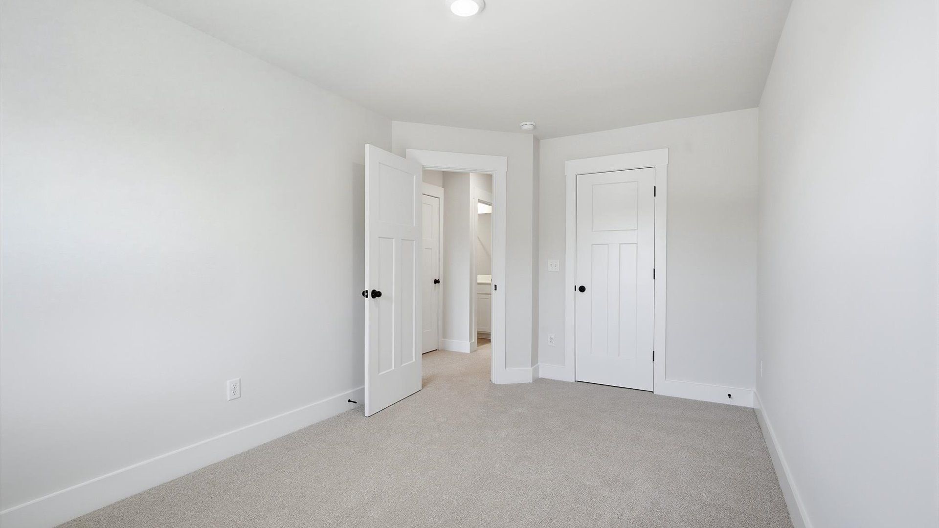 Relaxing bedroom space enhanced by soft carpet and impressive closet storage at Marion Square