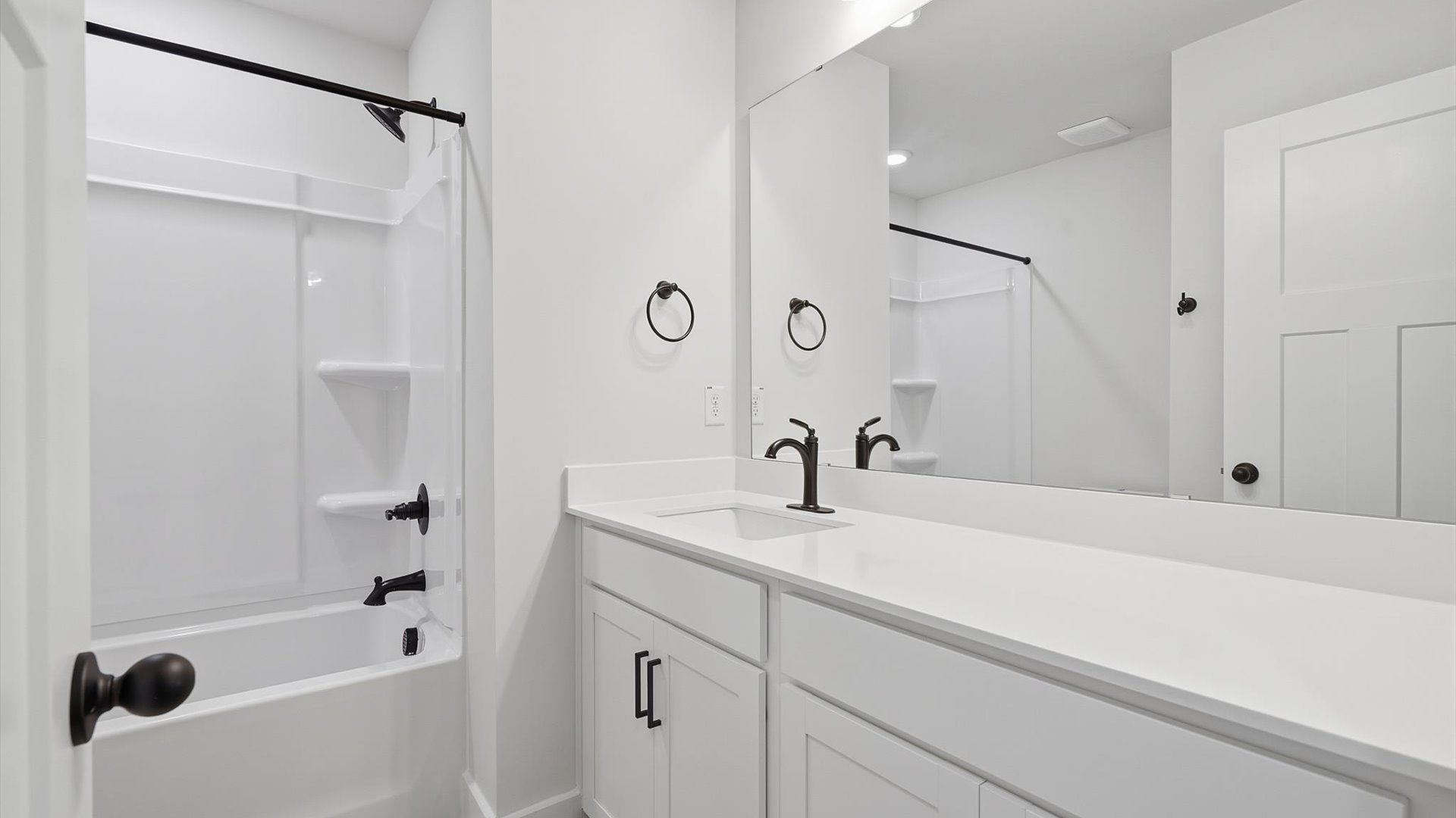 Vibrant and welcoming bathroom with elegant countertop space and polished details