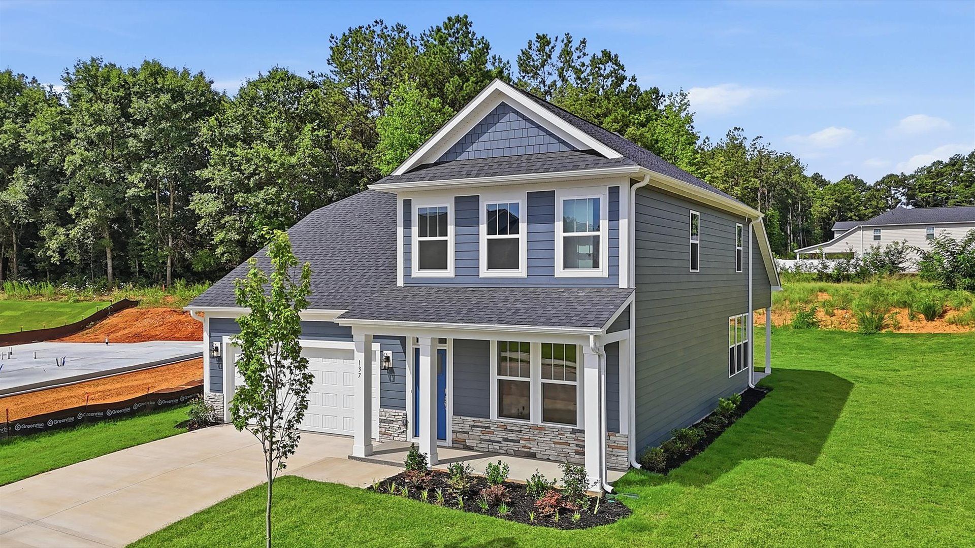 Refined exterior design with balanced architectural detail in this distinguished two-story home at Creeks at Midway