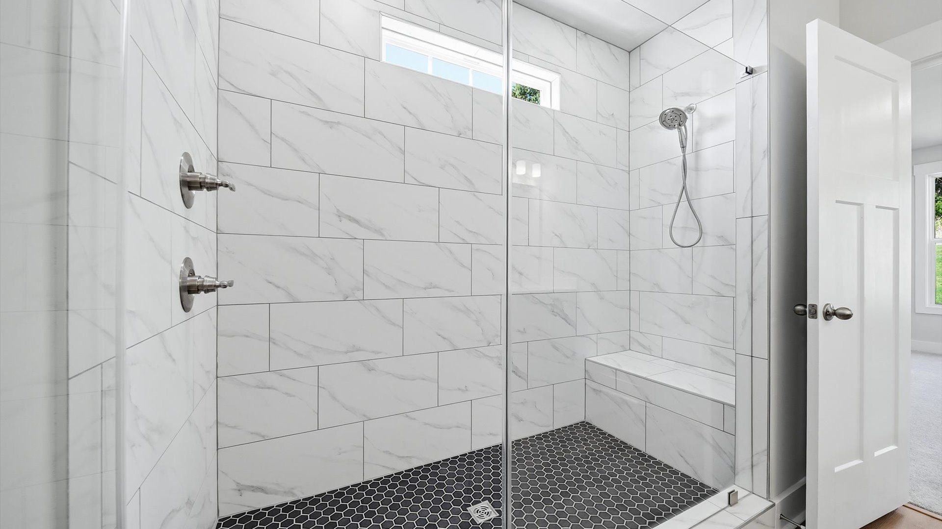 Sophisticated primary bathroom with an expansive walk-in shower and refined finishes in Anderson, SC