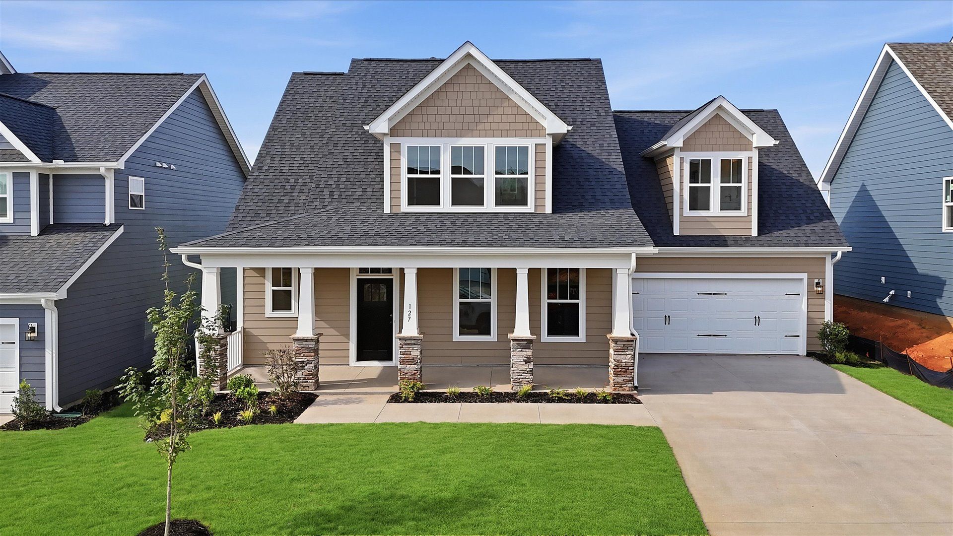 Elegant finishes and modern features in this proven DRB Homes design at Wells Crossing