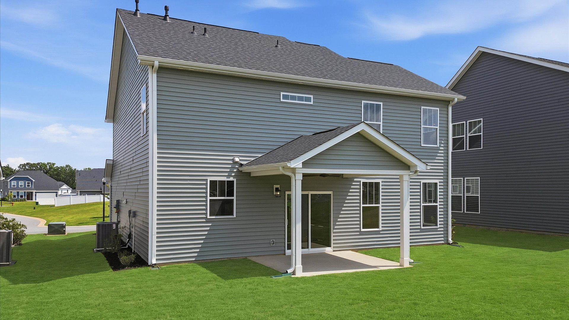Warm and inviting outdoor living space with a covered rear porch and tasteful finishes located in Moore, SC