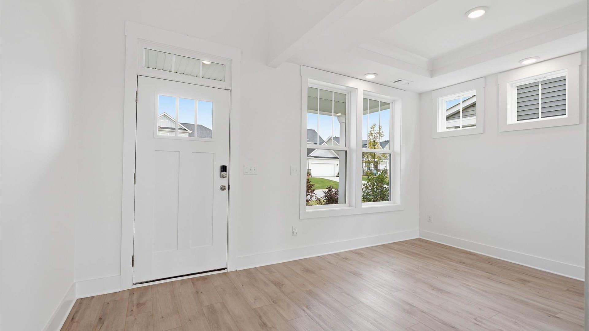 Superior design begins at the front door with a hardwood floor foyer and elegant sightlines in Moore, SC