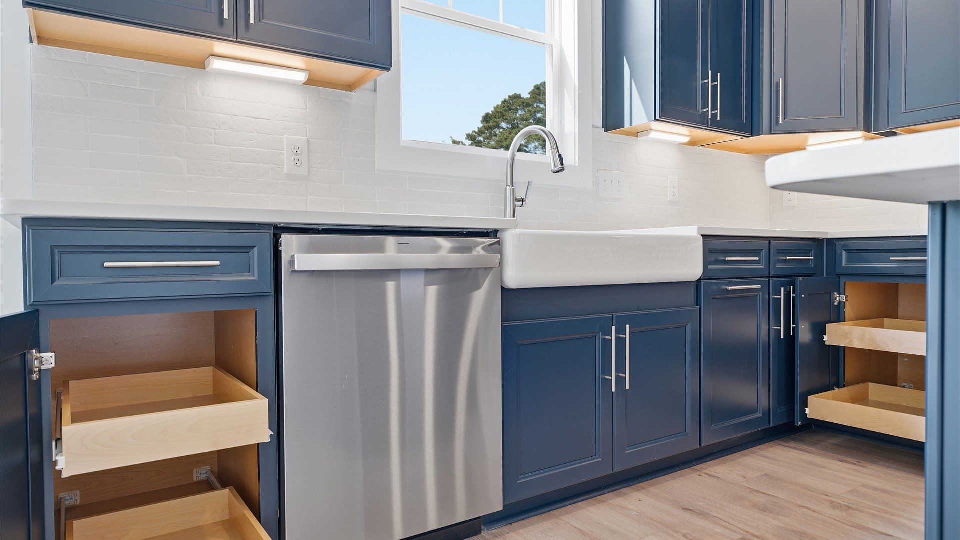 Luxury-inspired kitchen featuring expansive prep space and elegant design elements by DRB Homes