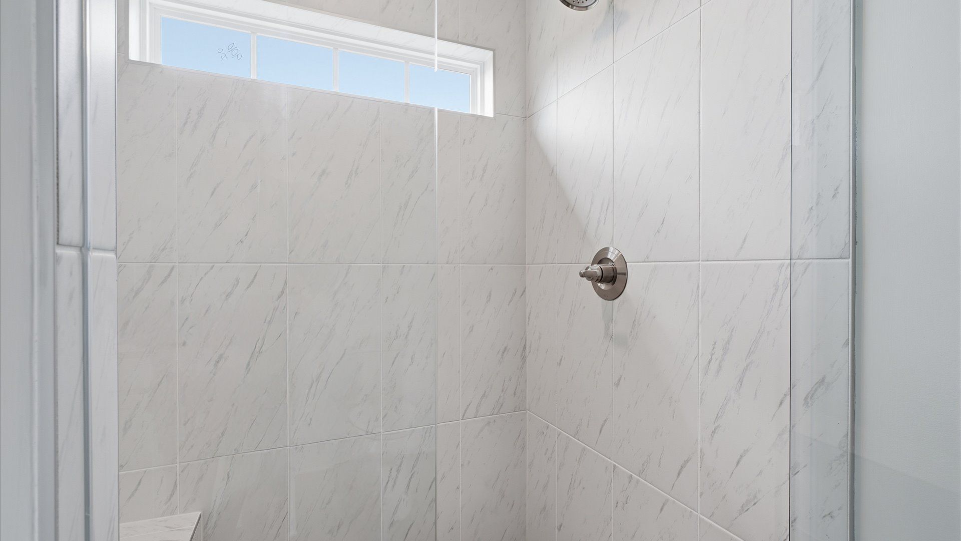 Sophisticated primary bathroom with a spacious walk-in shower and polished hardware located in Moore, SC