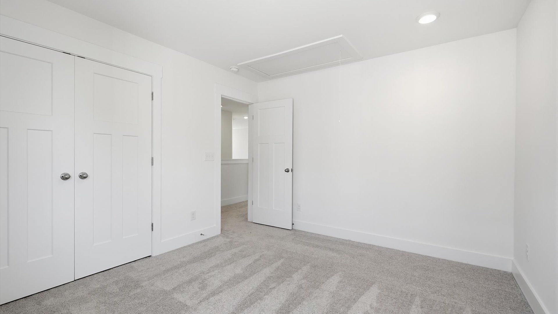 First-class secondary bedroom with comfortable carpeted flooring and generous closet space located in Moore, SC