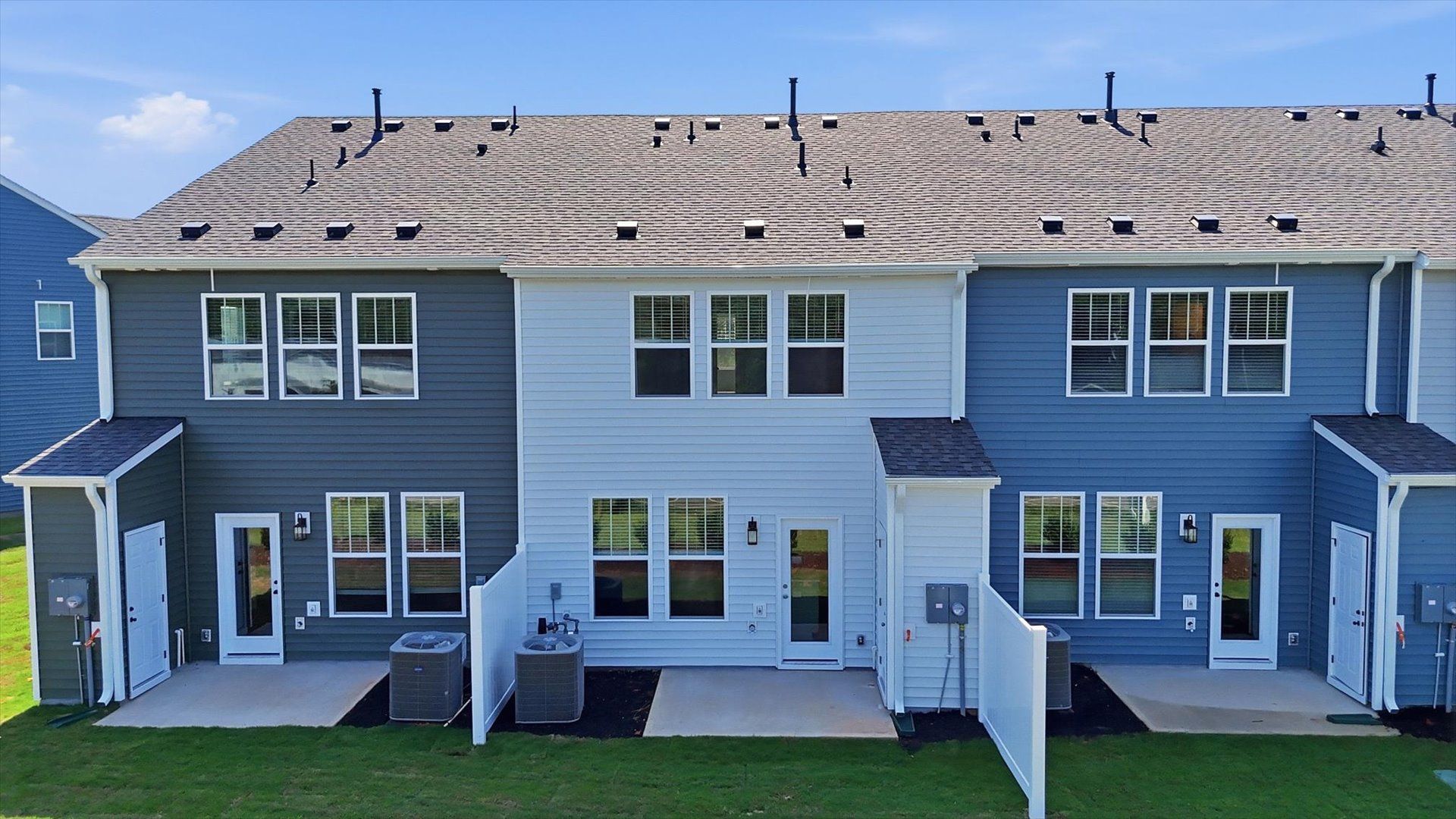 Refined rear exterior with a private backyard and patio for dining, relaxing, or entertaining by DRB Homes