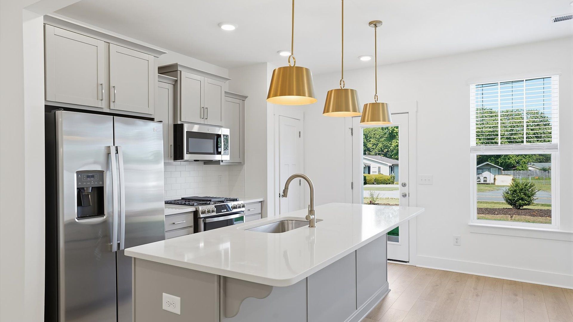 Well-designed kitchen with a center island and tasteful finishes that elevate everyday living at Saluda Crossing