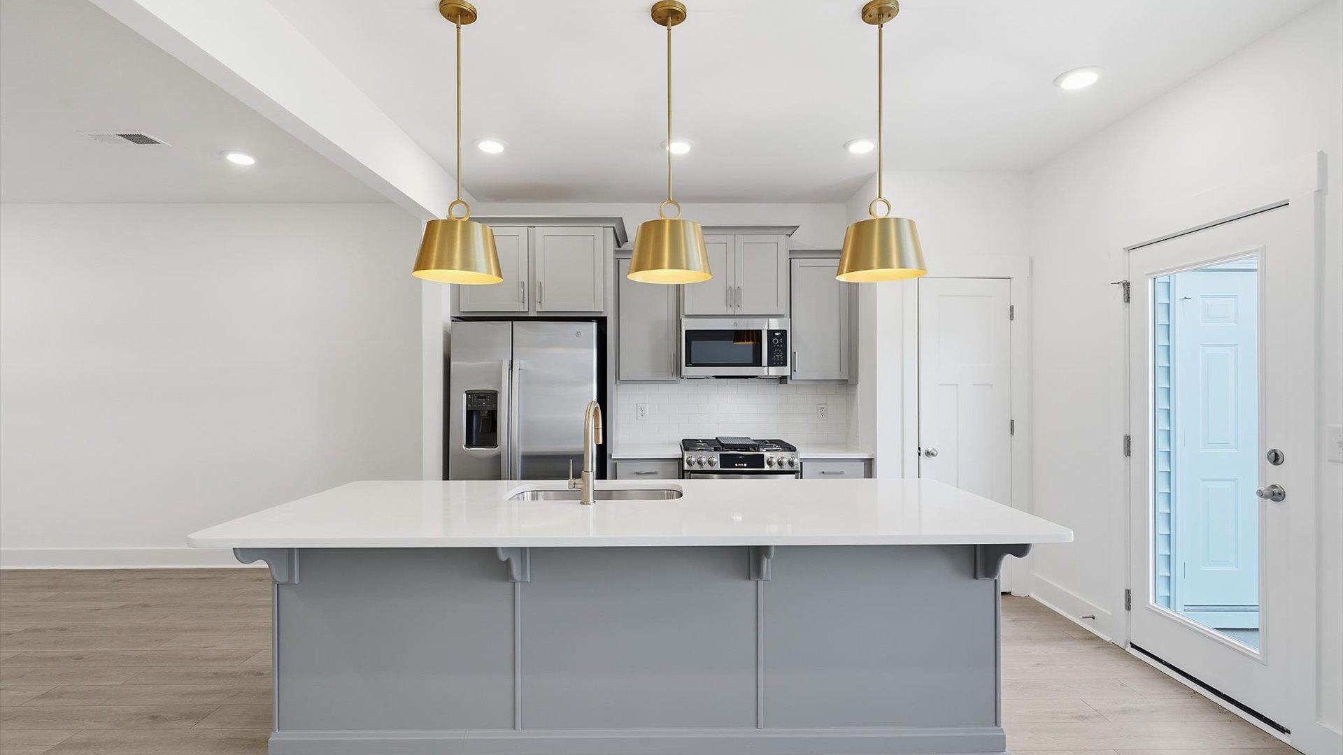 First-rate kitchen with functional layout, designer pendant lighting, and a large center island in Piedmont, SC