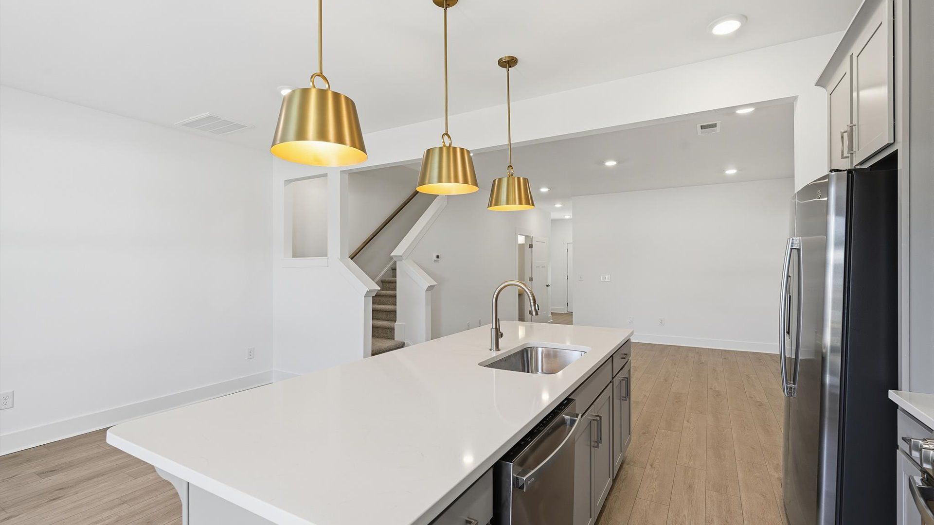 Luxury-inspired kitchen featuring expansive prep space and elegant design elements at Saluda Crossing
