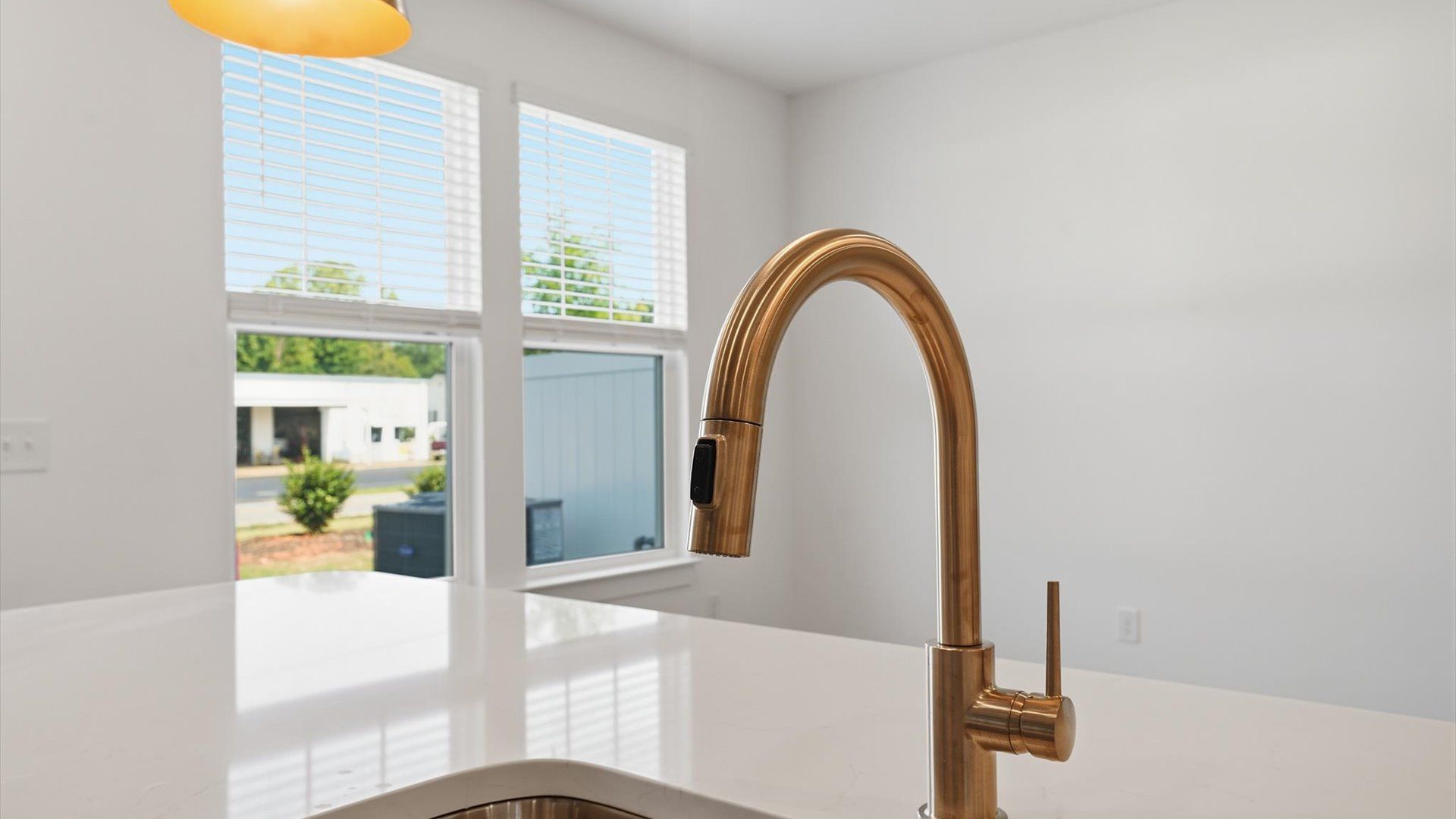 Beautifully appointed kitchen with spacious counters and sophisticated detailing by DRB Homes