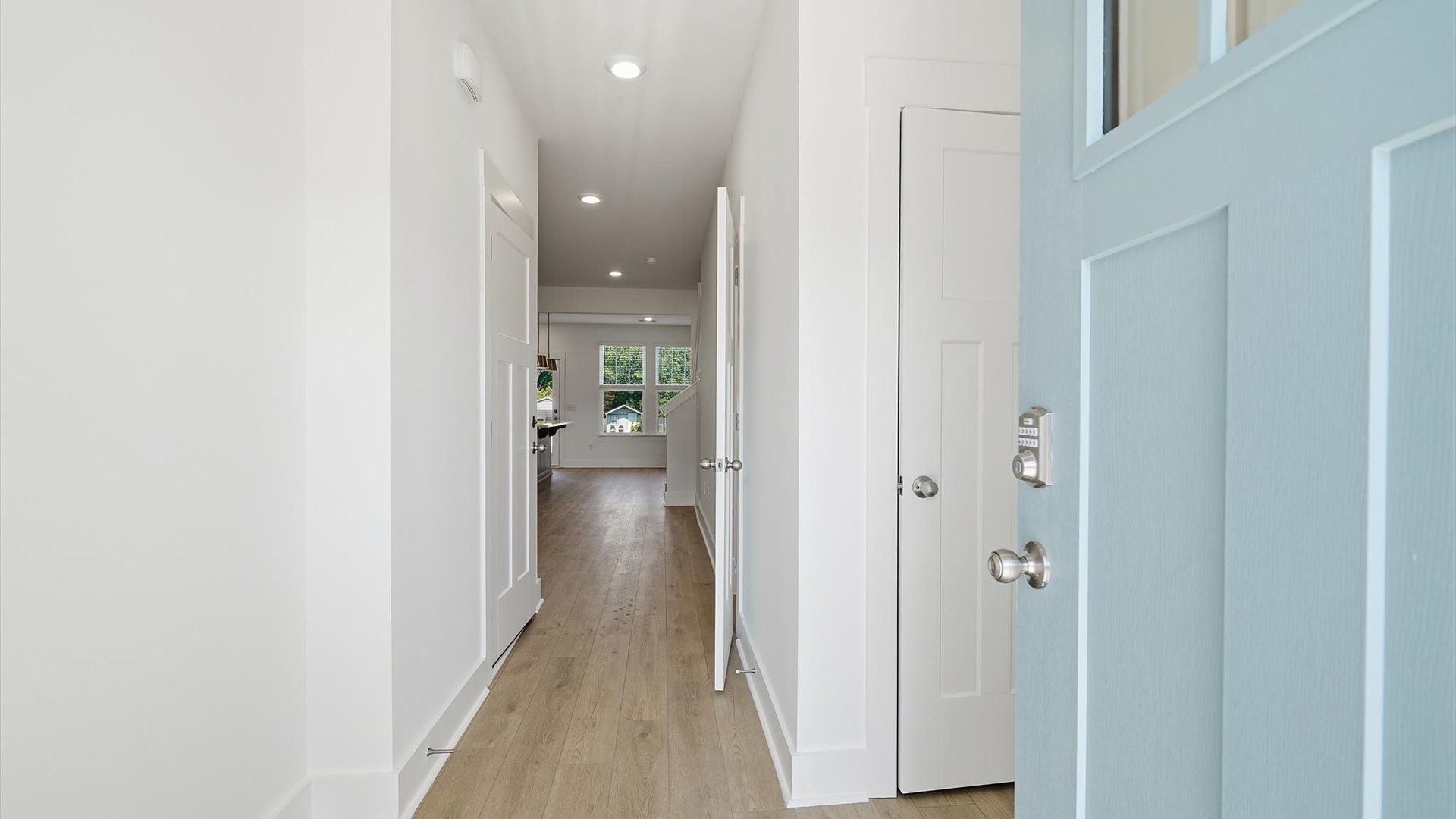 Memorable arrival experience with hardwood floors and elegant trim in the foyer