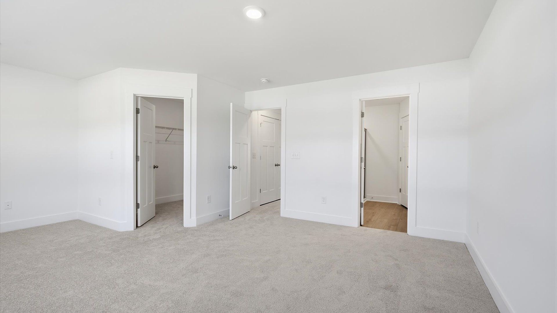 Eye-catching details and elegant finishes in the vibrant primary suite of this select home by DRB Homes