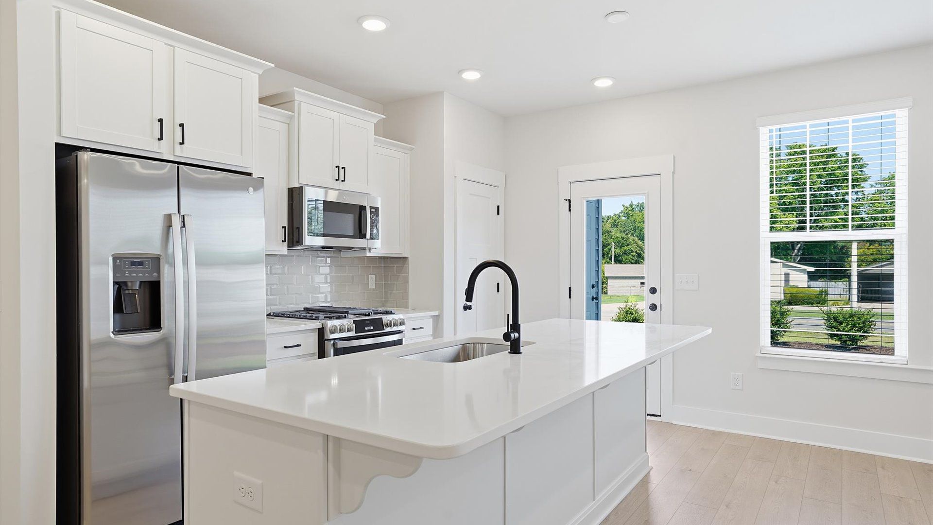 Elegant island anchors this tasteful kitchen with high standards and timeless appeal located at Saluda Crossing