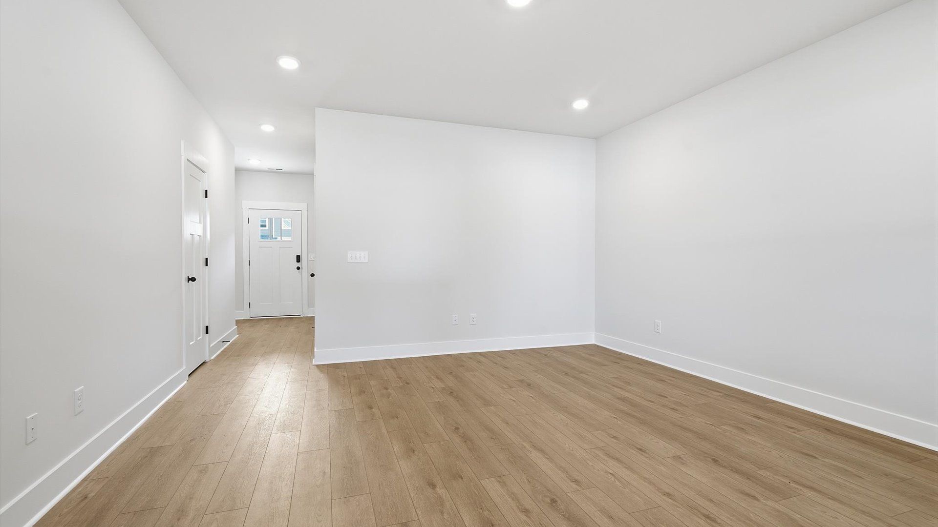 Hardwood flooring and high standards define this vibrant family room ideal for everyday living at Saluda Crossing
