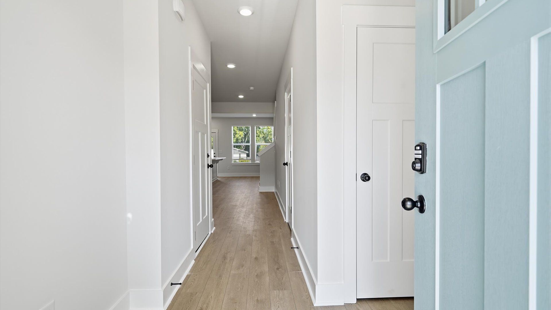 Superior design begins at the front door with a hardwood floor foyer and elegant sightlines