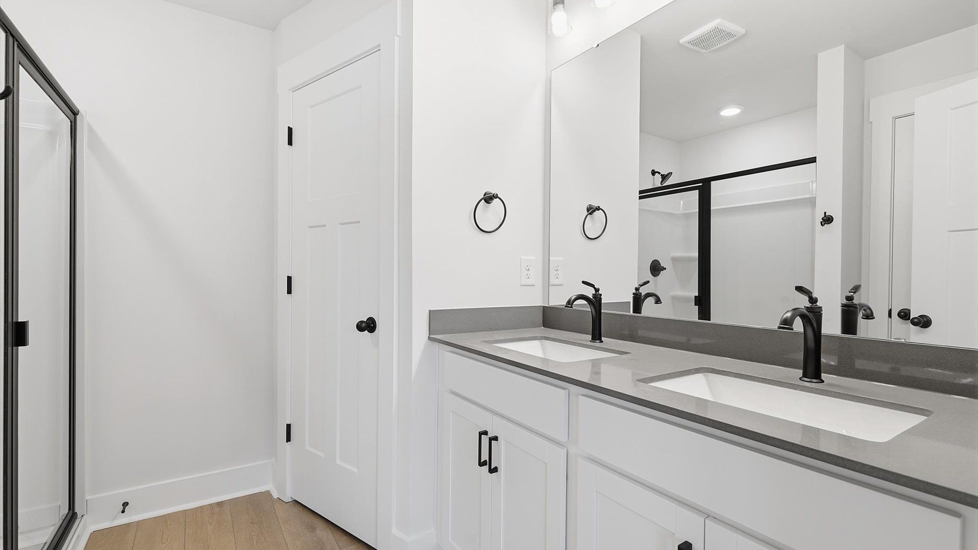Notable primary suite with dual vanities and walk-in shower in this prime Piedmont villa