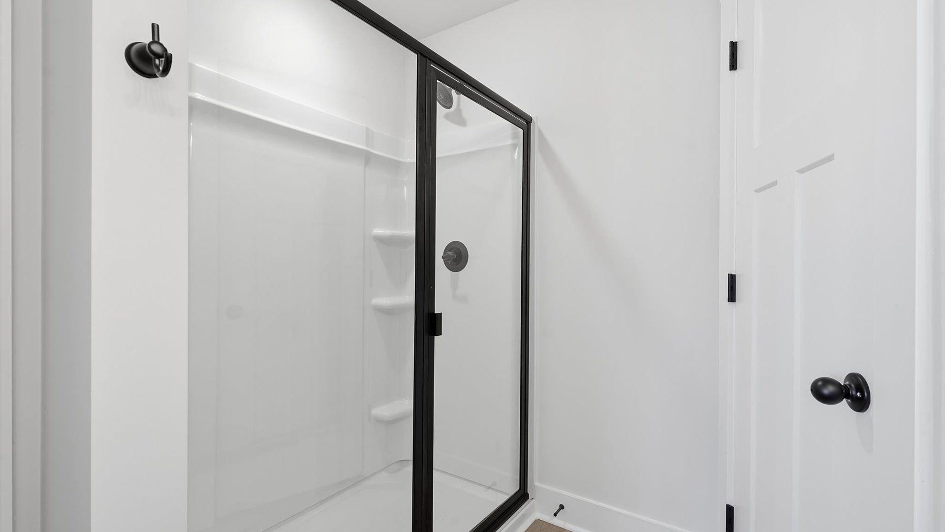 Memorable mornings begin in this elegant primary bathroom with a spacious walk-in shower and refined finishes by DRB Homes