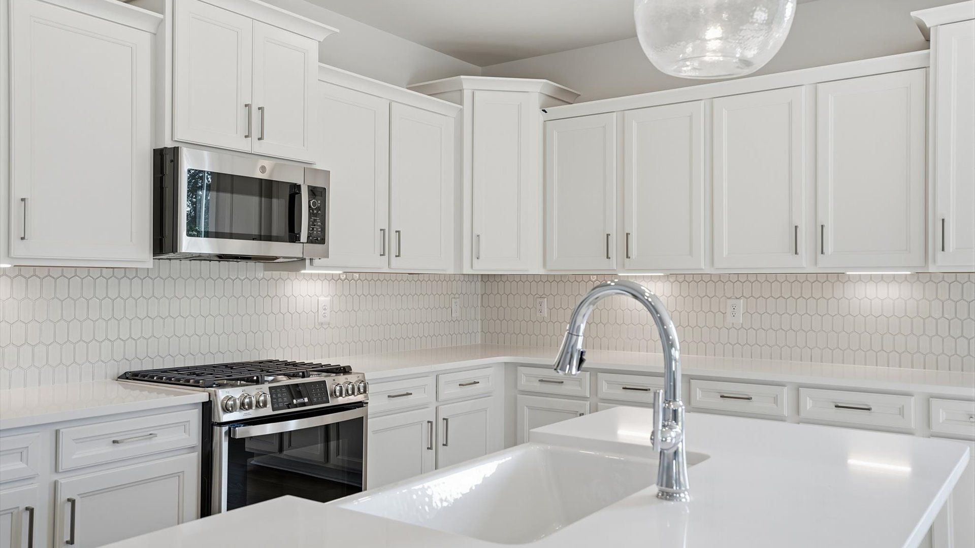 First-class finishes and a thoughtfully scaled island highlight this elegant kitchen space near Lake Hartwell