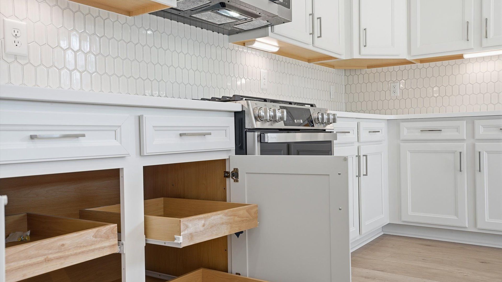 Well-designed kitchen with ample storage and tasteful finishes that elevate everyday living by DRB Homes