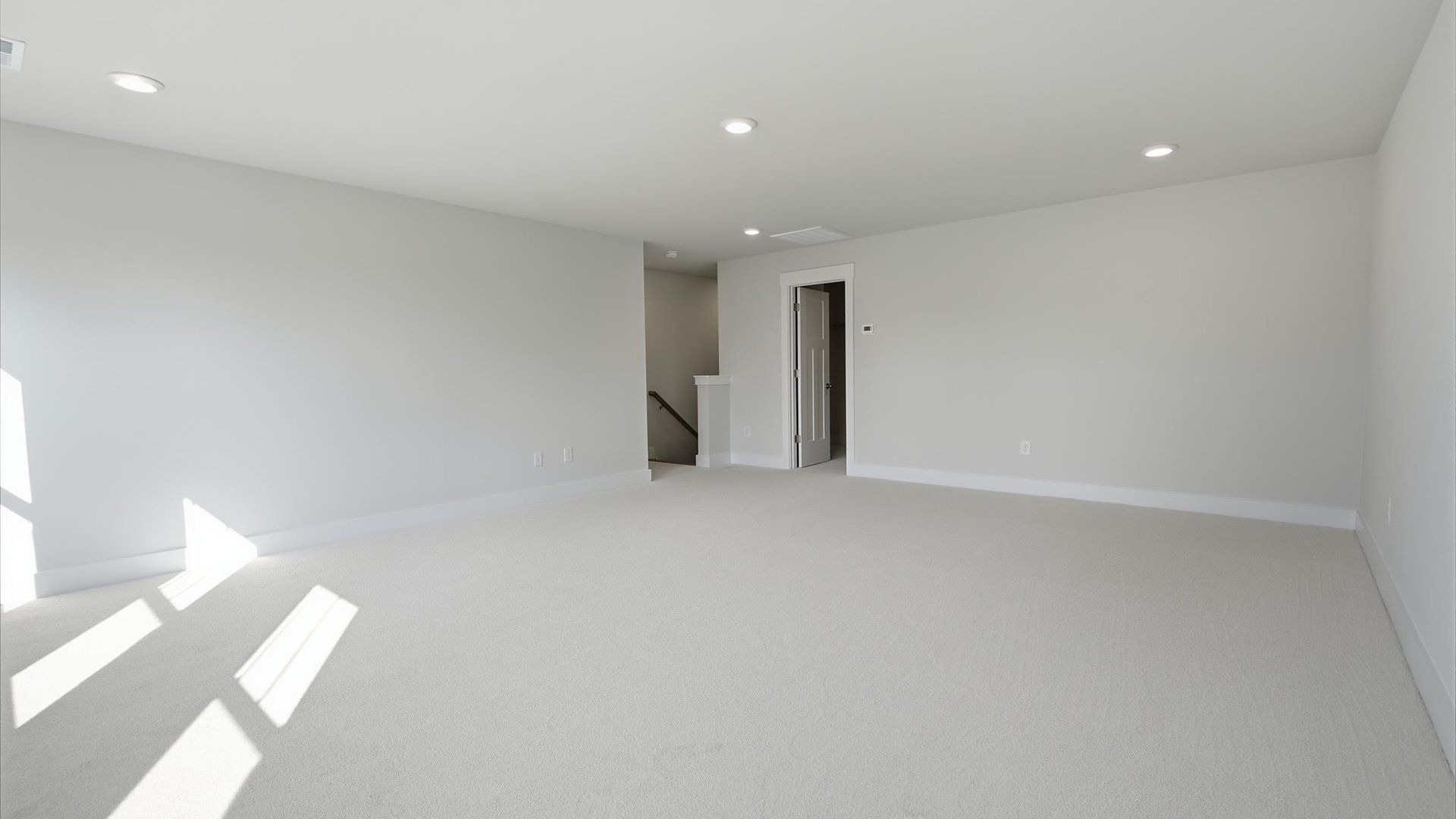 Refined bonus room with comfortable carpeted flooring and tasteful design throughout by DRB Homes