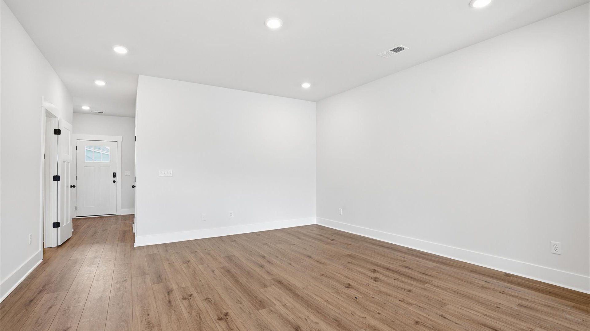 Memorable moments begin in this elegant, open family room with hardwood flooring and refined finishes