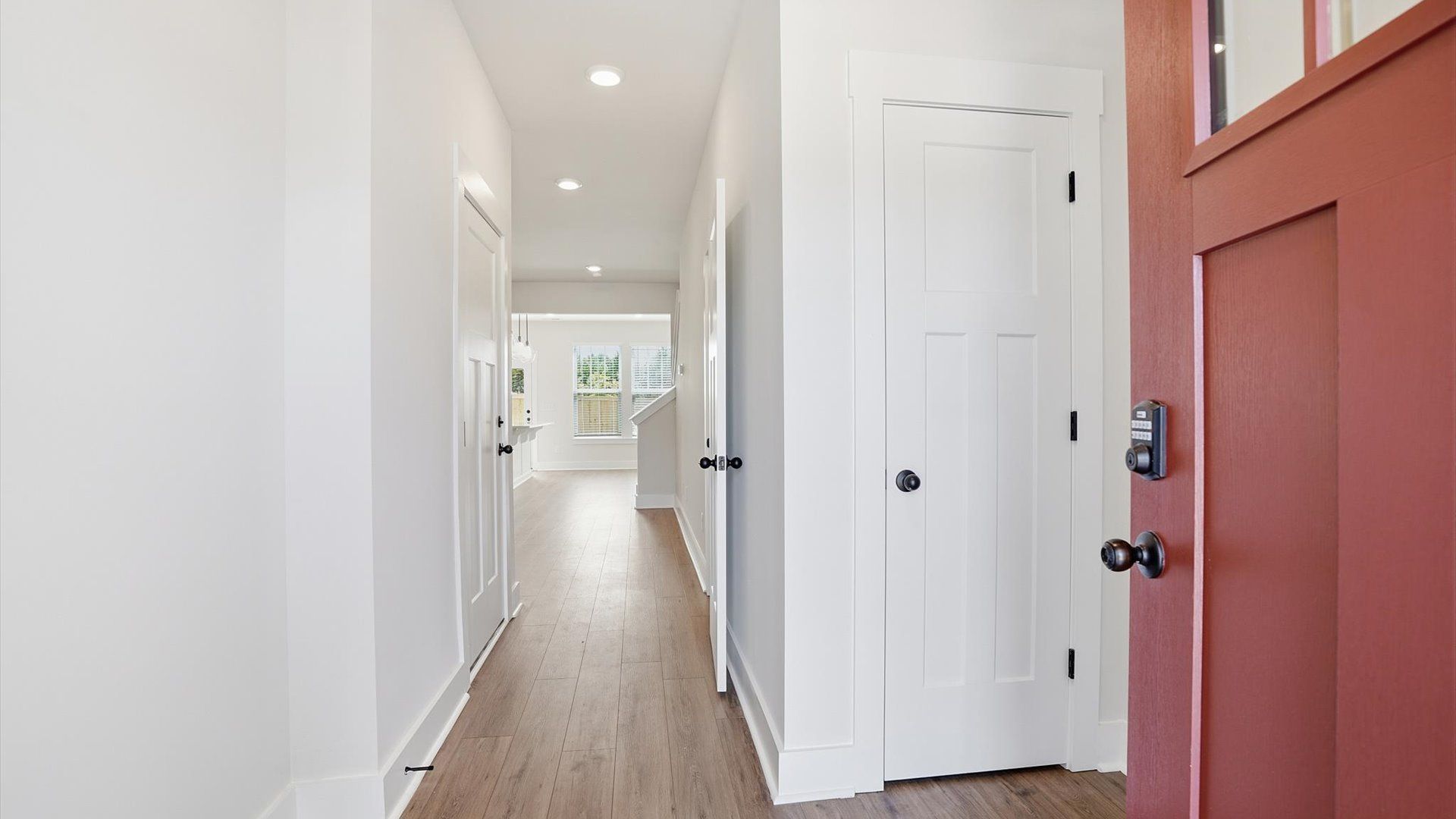 Stylish foyer with hardwood flooring and tasteful architectural detail in a superior layout at Barton Hollow