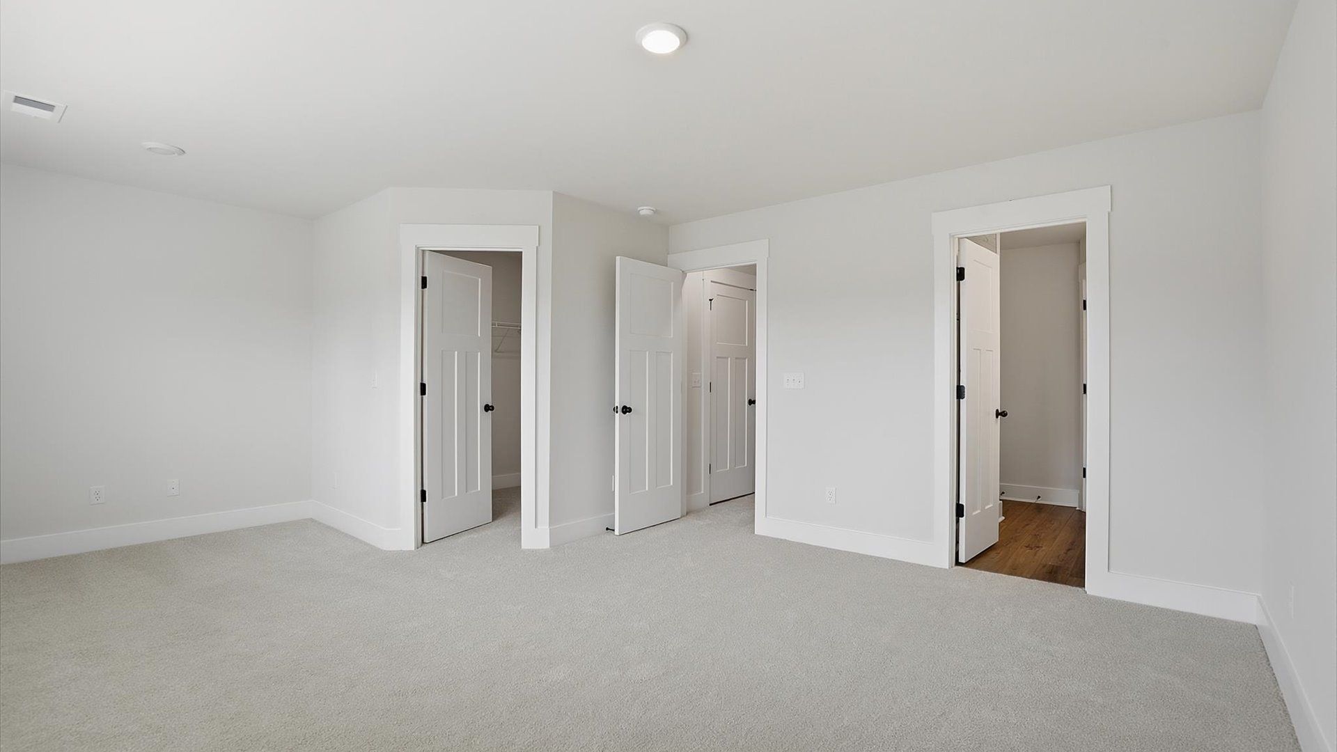 Primary suite that offers first-rate relaxation with established style and elevated finishes by DRB Homes