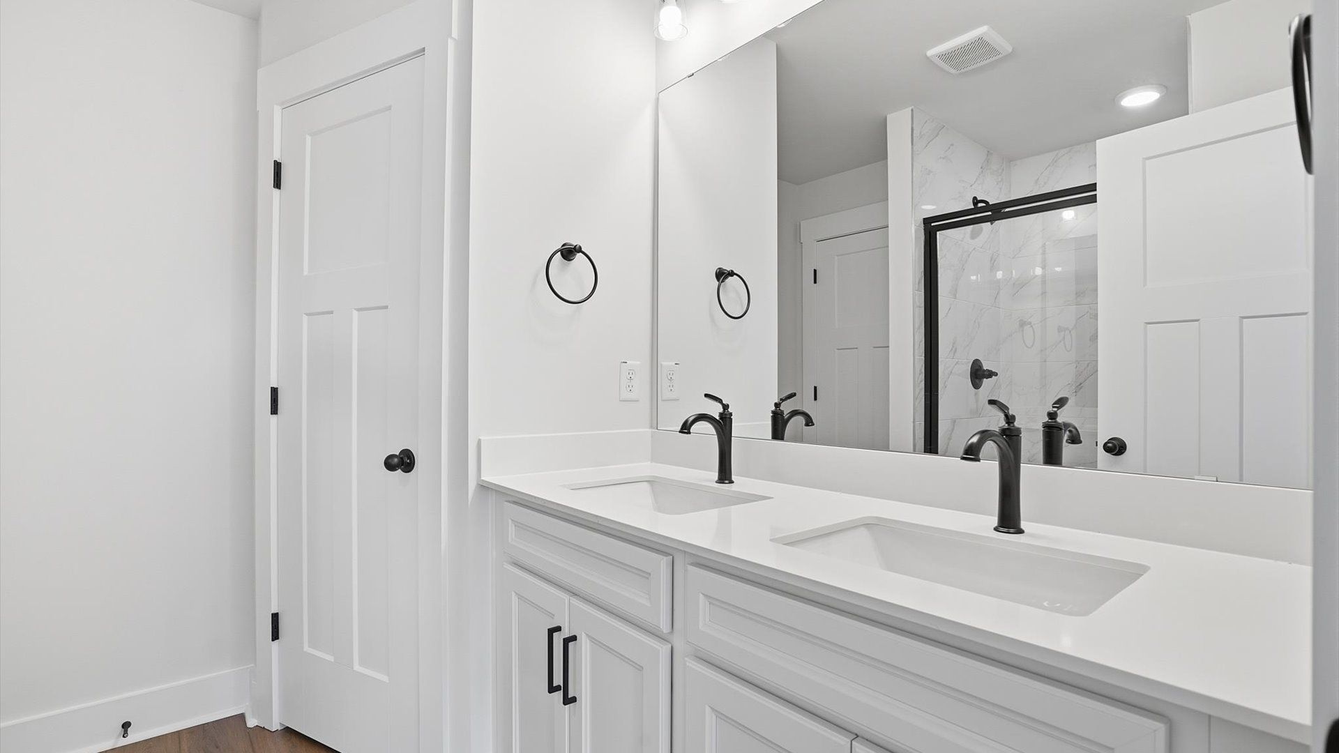 First-rate primary bathroom offering an elegant walk-in shower and dual sinks with superior style at Barton Hollow