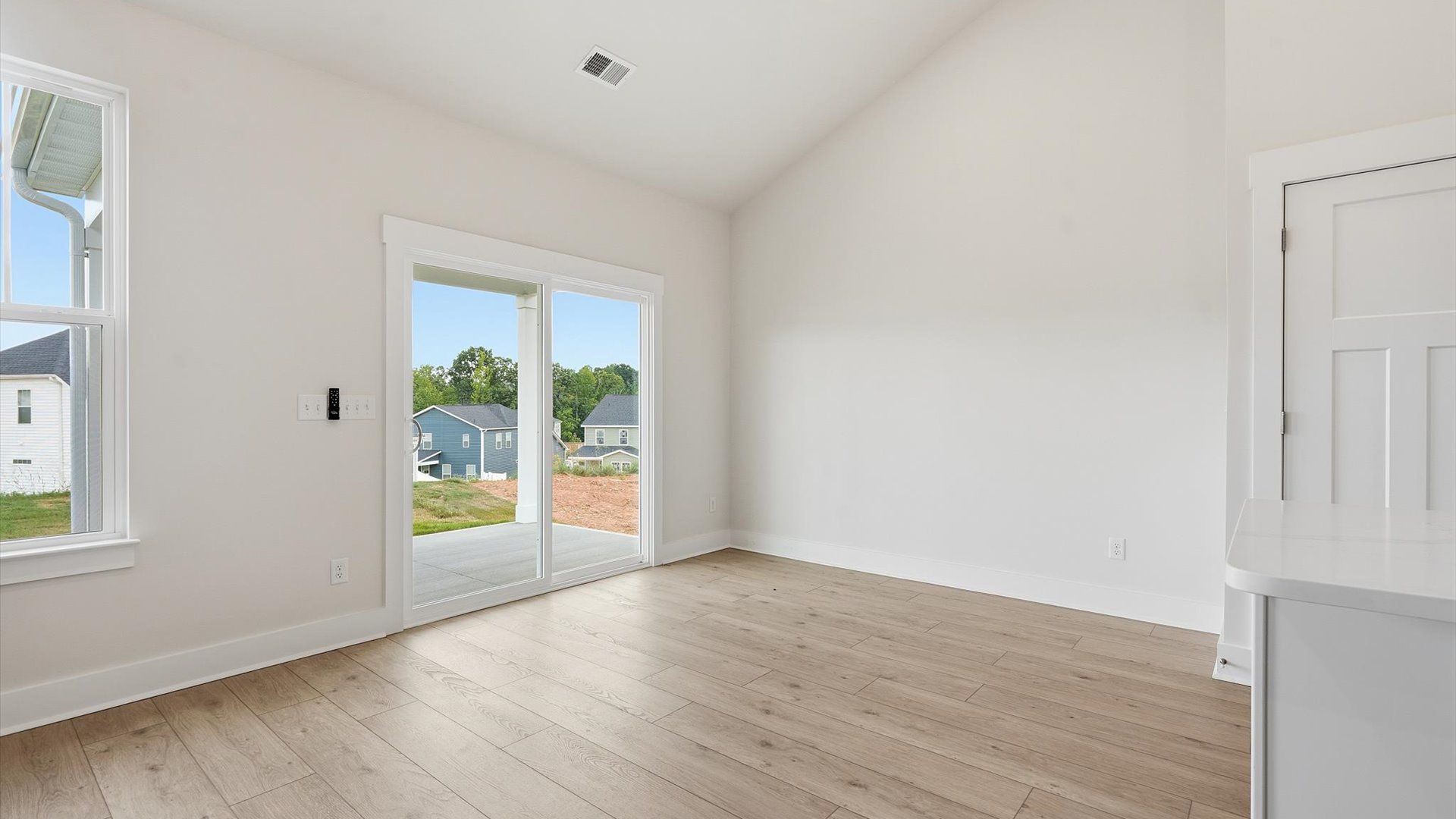 Inviting breakfast area with a seamless connection to the kitchen for everyday living at Iris Meadows
