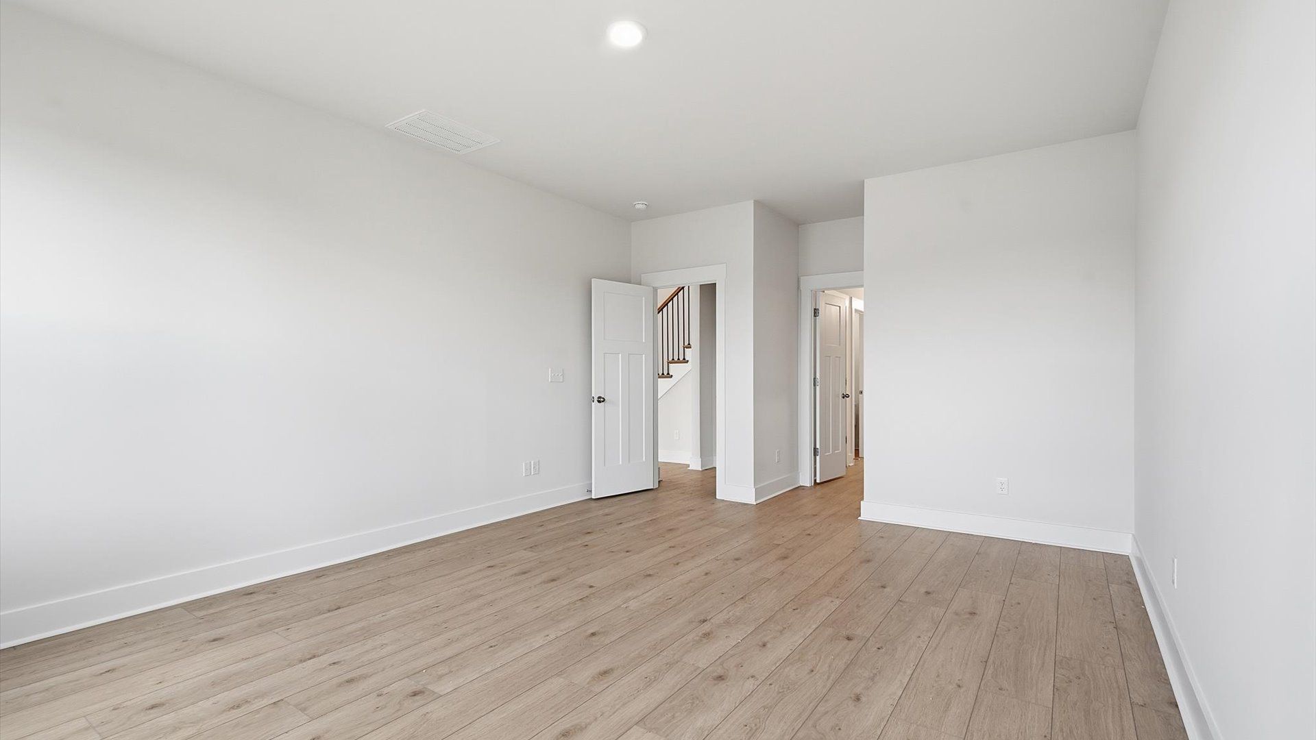 Memorable mornings begin in this tasteful and thoughtfully crafted primary suite at the Iris Meadows community