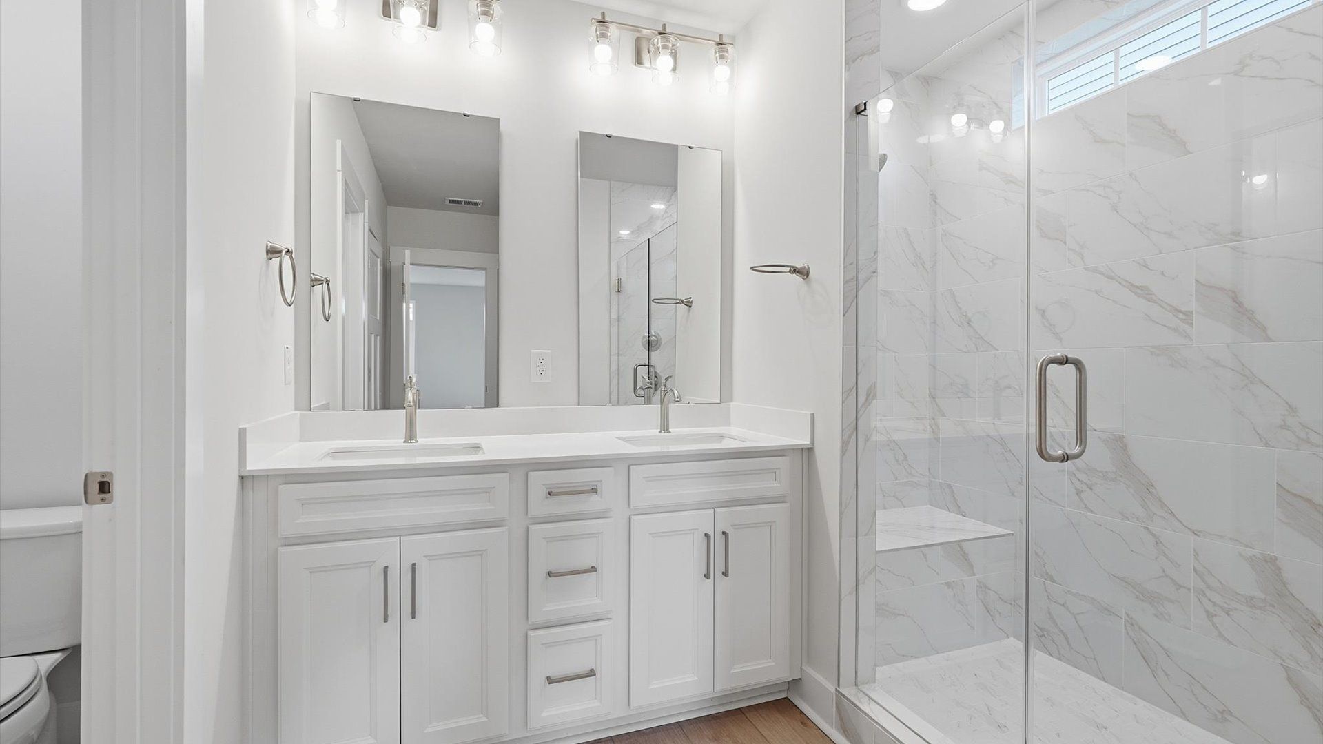 Tasteful primary bath with modern finishes, a walk-in shower, and thoughtful double vanity layout in Moore, SC