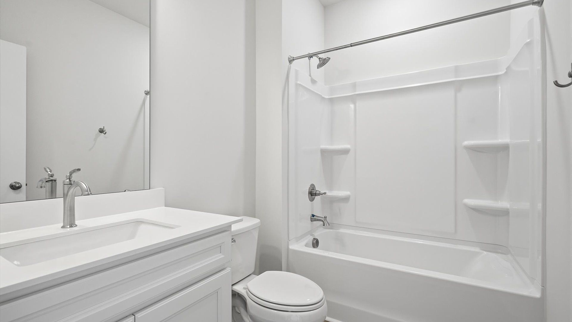 Accomplished full bath designed with both comfort and sophistication in mind at the Iris Meadows community