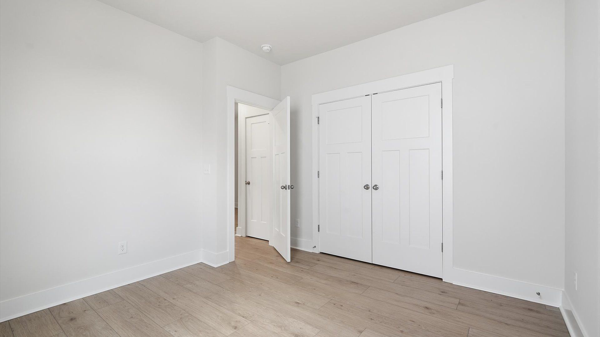 Notable secondary bedroom offering hardwood flooring and a stylish walk-in closet located in Moore, SC