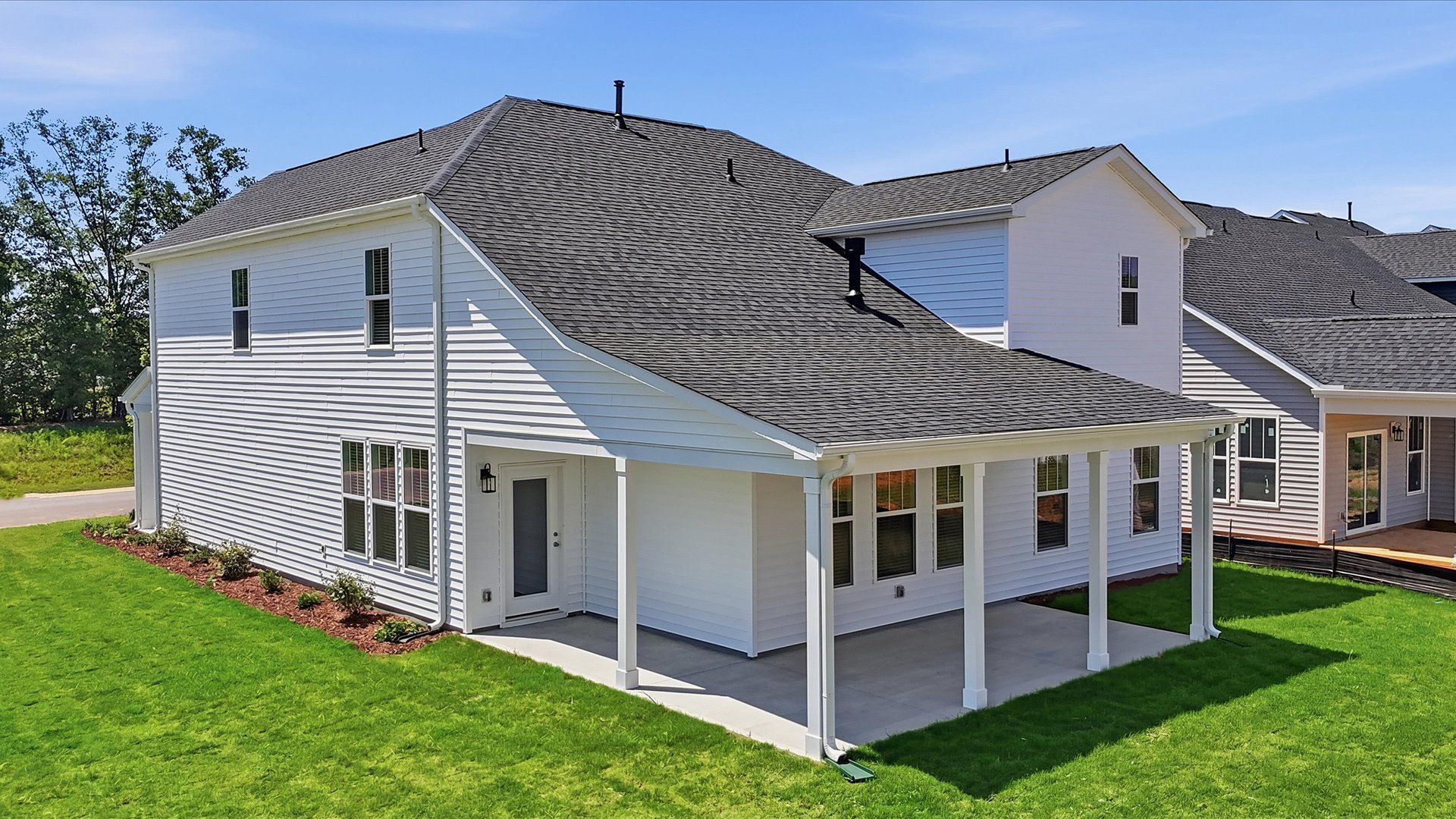 Highly functional rear covered porch adds memorable living space to this elegant home by DRB Homes