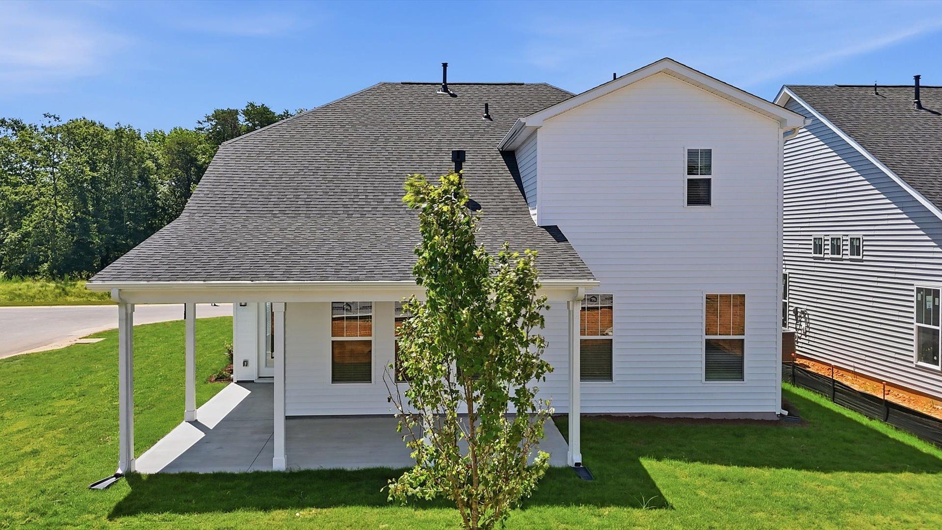 Established charm meets functional outdoor living with a spacious rear covered porch at Walnut Ridge