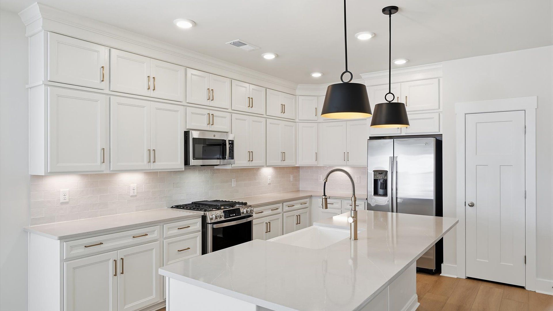 Vibrant kitchen layout with a center island, refined finishes, and open-concept flow located at Walnut Ridge