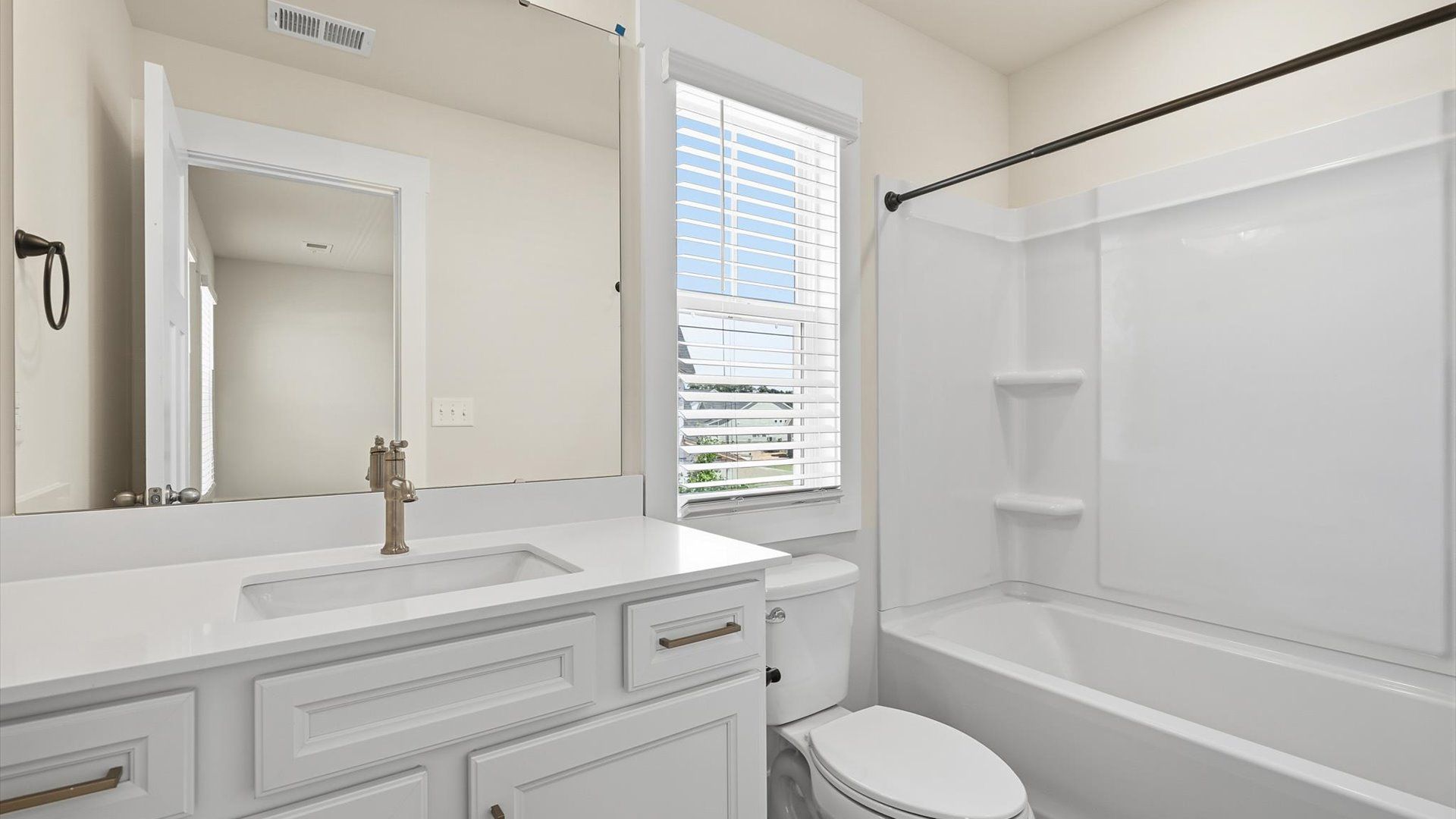 Well-appointed full bath with high standards of craftsmanship and everyday function at the Walnut Ridge community