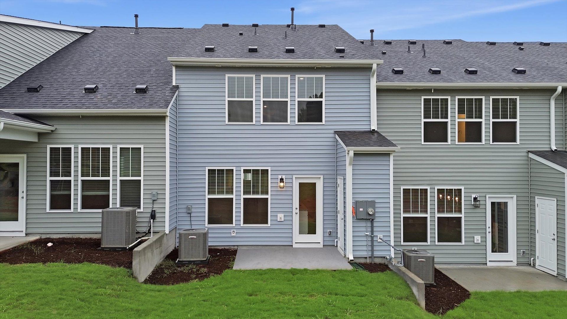 Vibrant rear outdoor space featuring a spacious patio and exceptional craftsmanship at Aspen Ridge