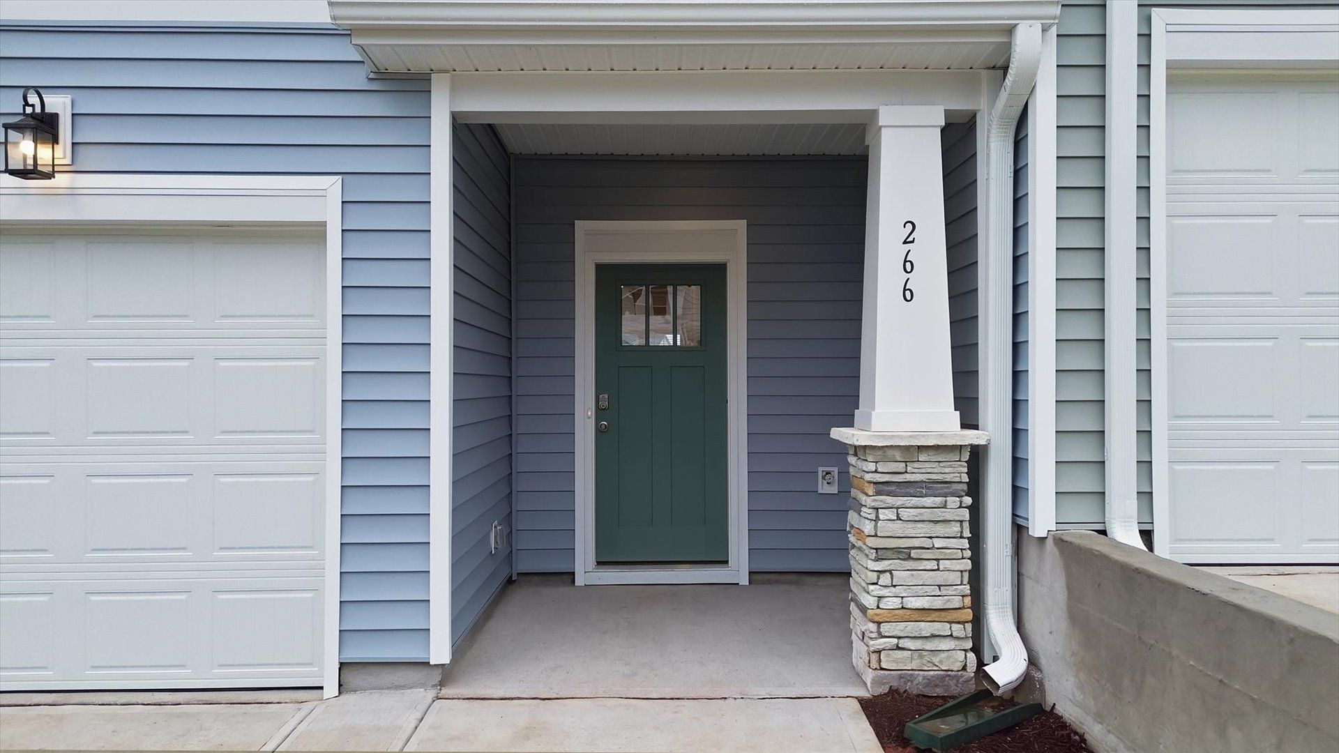 Notable street presence with tasteful elevation and thoughtful landscaping at the Aspen Ridge community