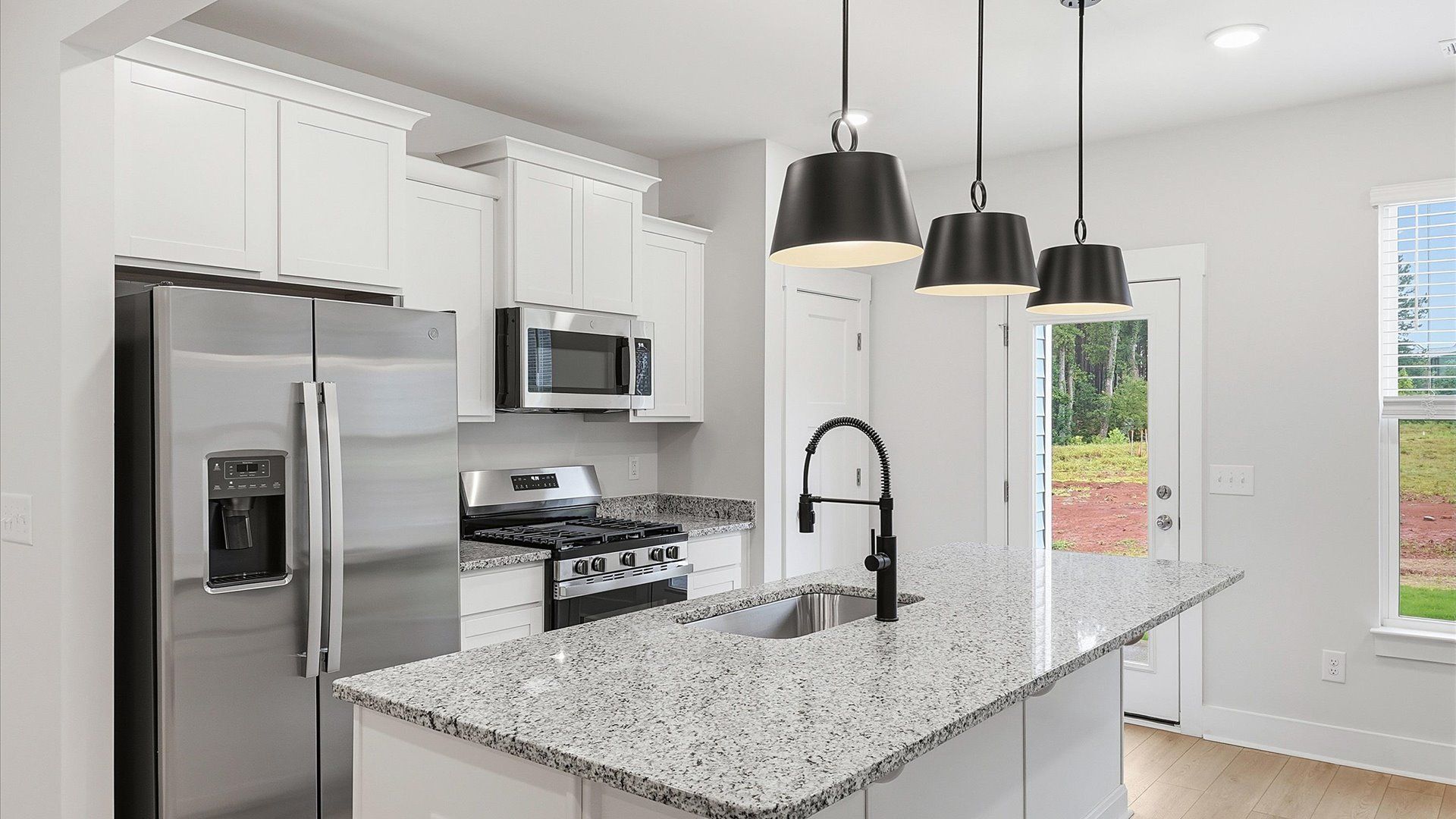 Tasteful kitchen with a center island and stylish pendant lighting—crafted to high standards in Lyman, SC