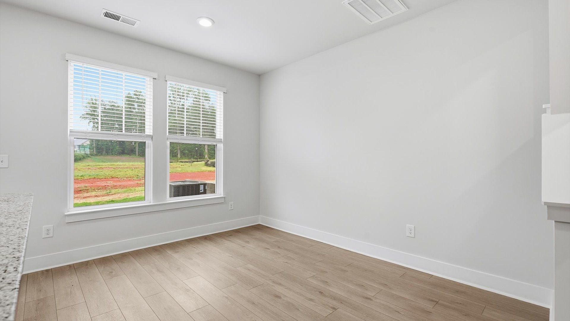 Inviting breakfast area with a seamless connection to the kitchen for everyday living in Lyman, SC