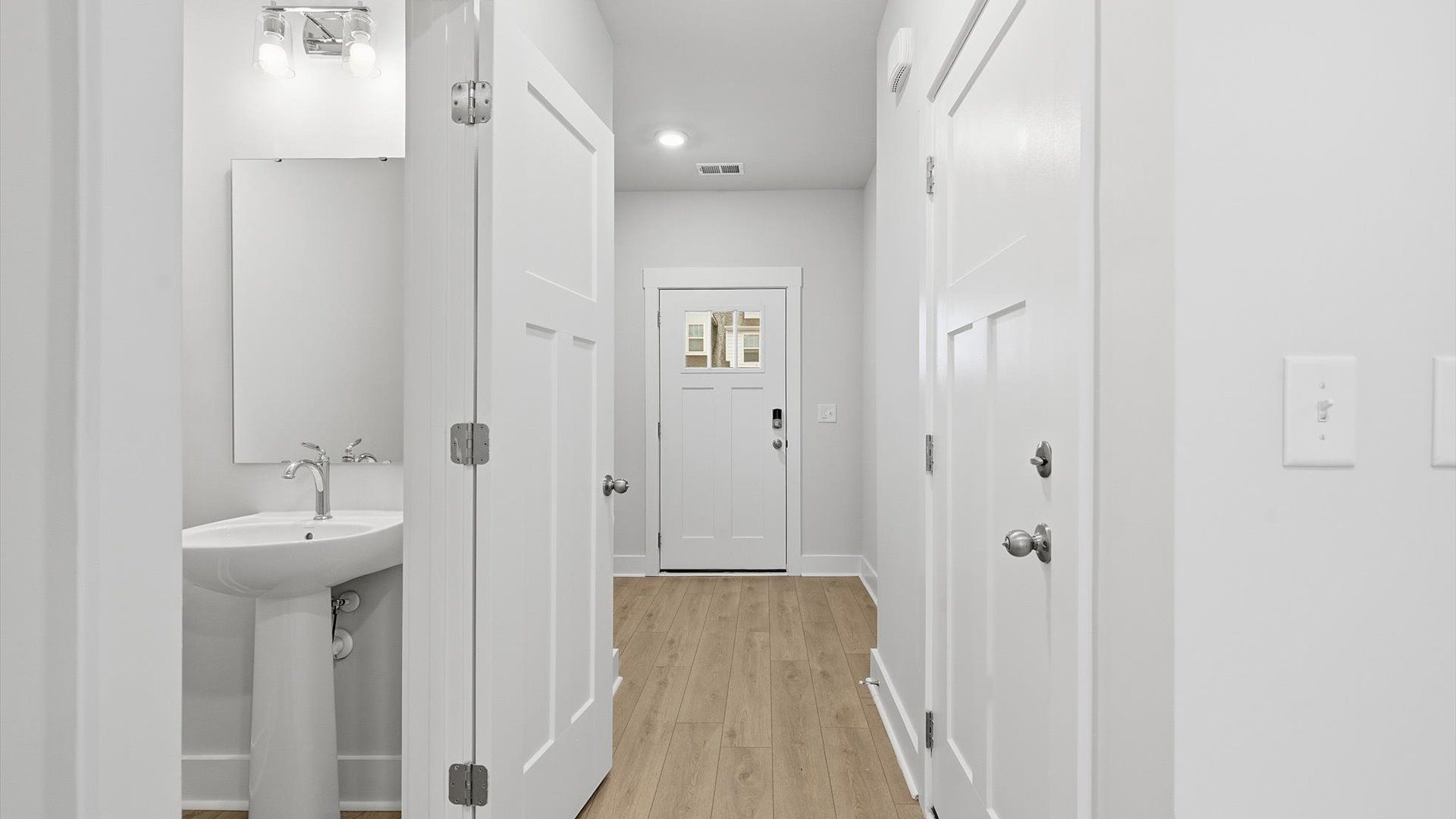 Vibrant entry highlighted by hardwood floors and accomplished design choices near Downtown Greer