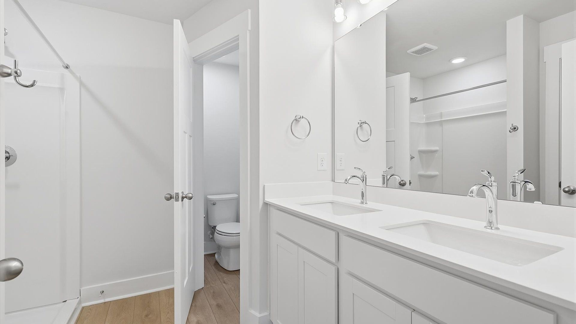 Notable primary suite with dual vanities and walk-in shower in this prime Lyman villa
