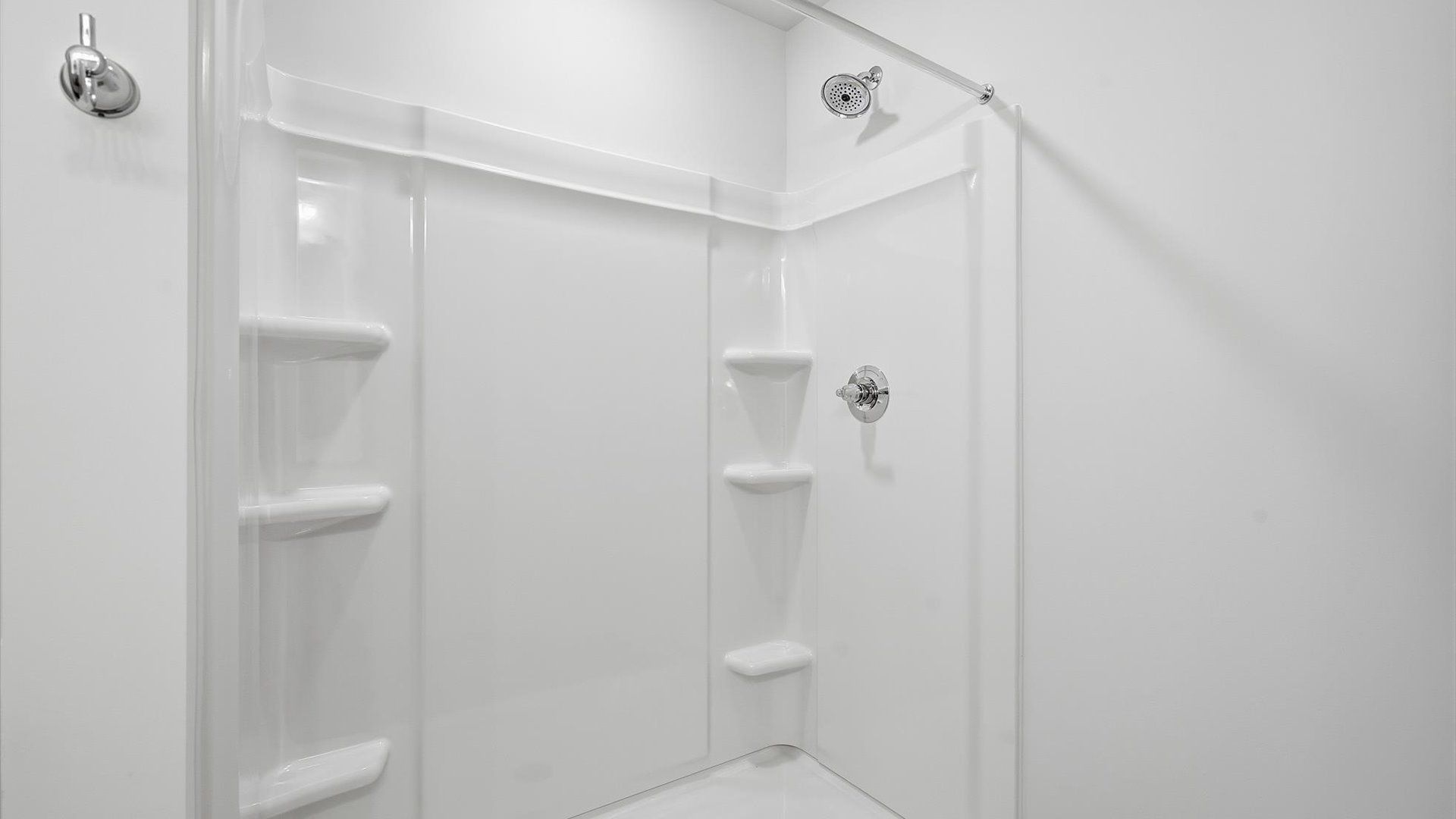 Notable primary bath featuring dual vanity, walk-in shower, and tasteful design touches throughout at Aspen Ridge