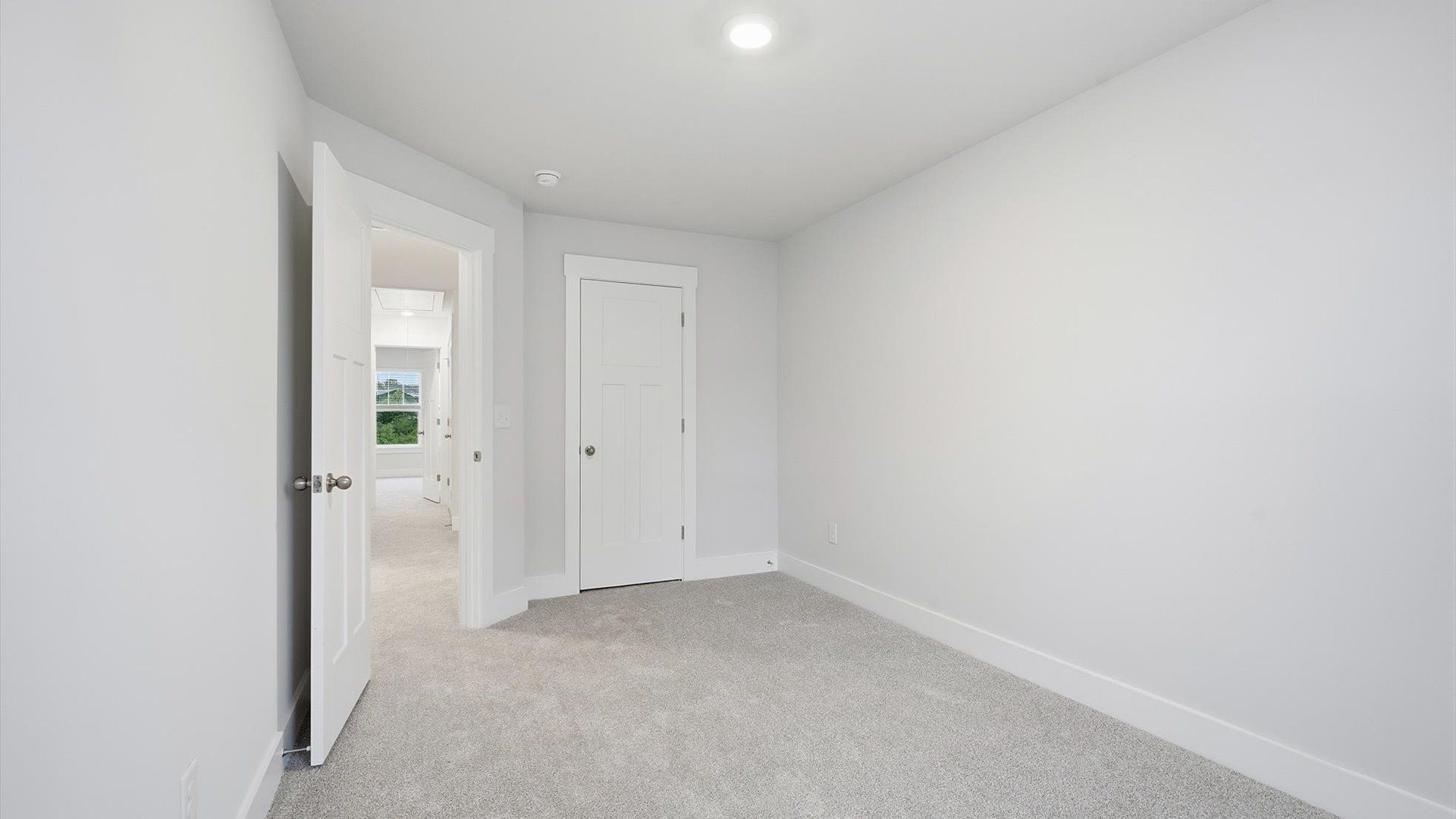 First-class secondary bedroom with comfortable carpeted flooring and generous closet space in Lyman, SC