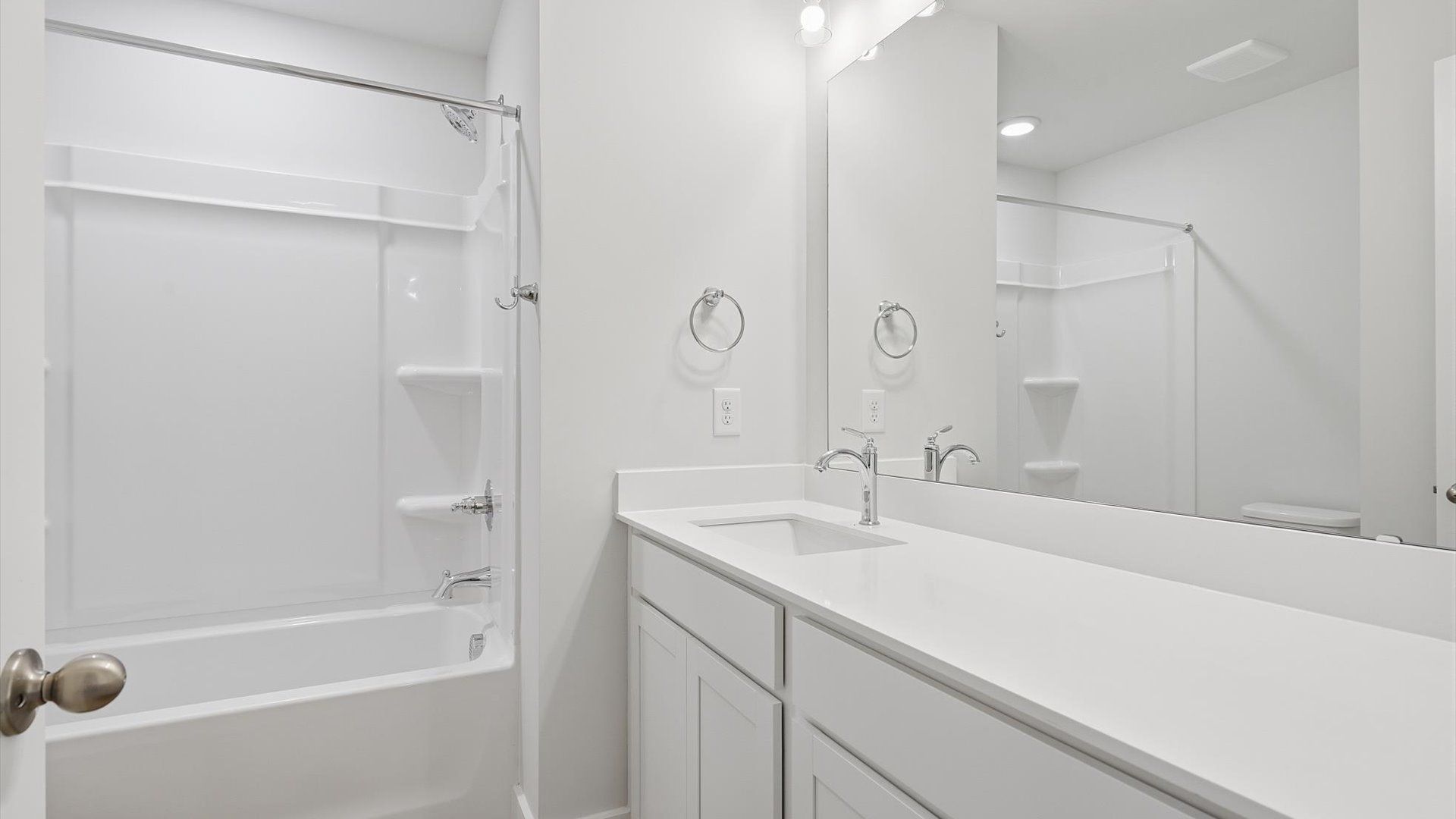 Accomplished bathroom design with sleek tile, high-quality cabinetry, and refined hardware near Downtown Greer