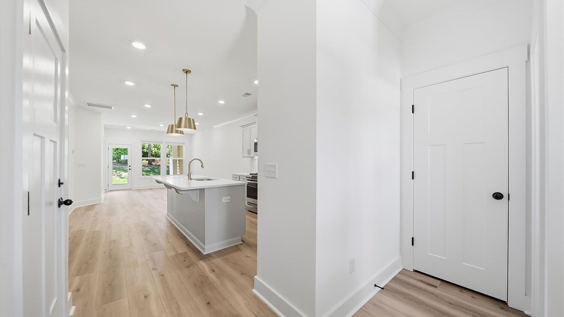 Superior design begins at the front door with a hardwood floor foyer and elegant sightlines