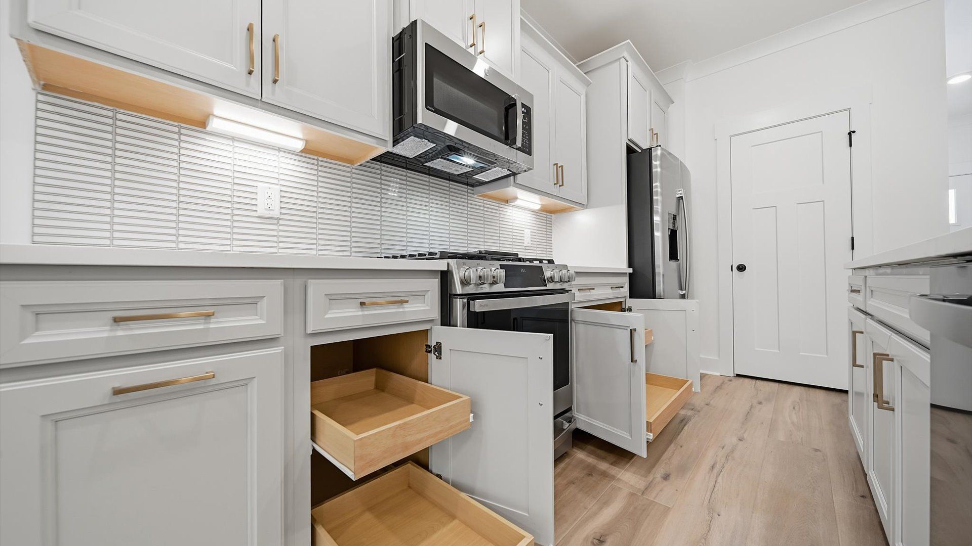Exclusive kitchen design with large island, pendant lights, and tasteful finishes throughout