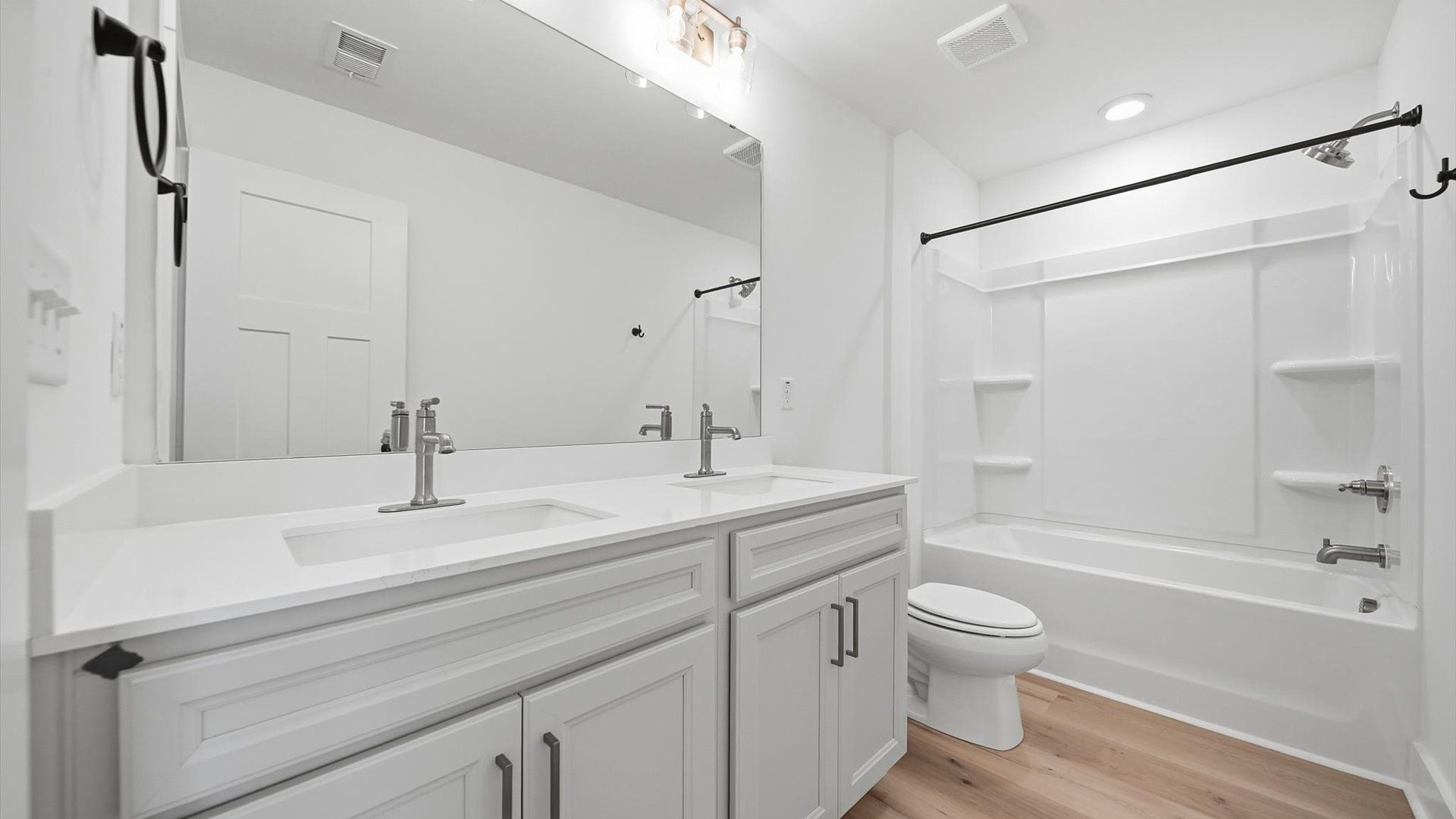 Vibrant and welcoming bathroom with elegant countertop space and polished details